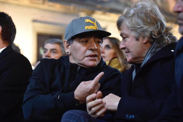 Maradona (left) talks to Fiorentina's former striker Giancarlo Antognoni during the ceremony. (AP)
