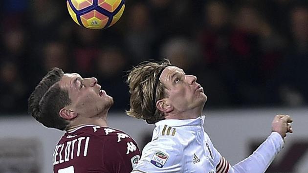 Torino's Andrea Belotti and AC Milan's Ignazio Abate vie for the ball during their Serie A match on Monday. (AP) Torino's Andrea Belotti and AC Milan's Ignazio Abate vie for the ball during their Serie A match on Monday. (AP)