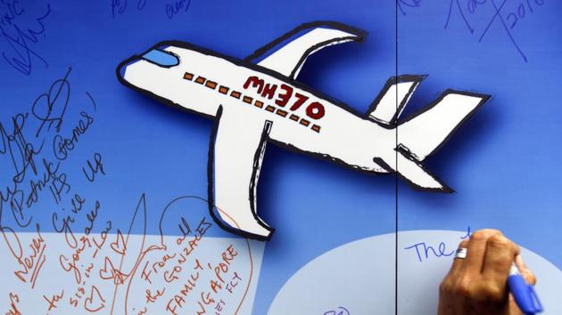 In this March 6, 2016, file photo, well wishes are written on a wall of hope during a remembrance event for MH 370 in Kuala Lumpur. (AP)