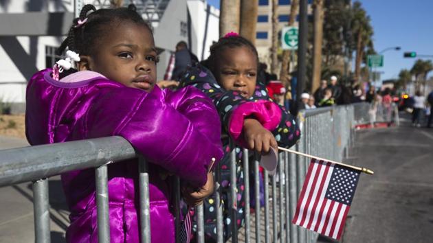 Ivey Holley, 2, and Alisha Miniweather, 5, watch the Martin Luther King Jr. Day parade in downtown Las Vegas. (Steve Marcus/ Las Vegas Sun via AP) Ivey Holley, 2, and Alisha Miniweather, 5, watch the Martin Luther King Jr. Day parade in downtown Las Vegas. (Steve Marcus/ Las Vegas Sun via AP)
