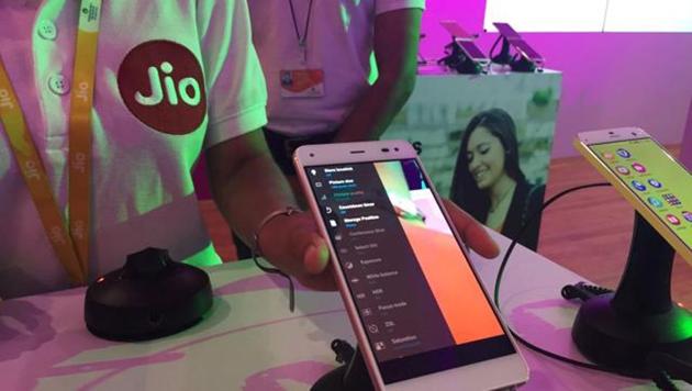 A Reliance employee demonstrates Jio LYF phone at their headquarters on the outskirts of Mumbai. (REUTERS) A Reliance employee demonstrates Jio LYF phone at their headquarters on the outskirts of Mumbai. (REUTERS)