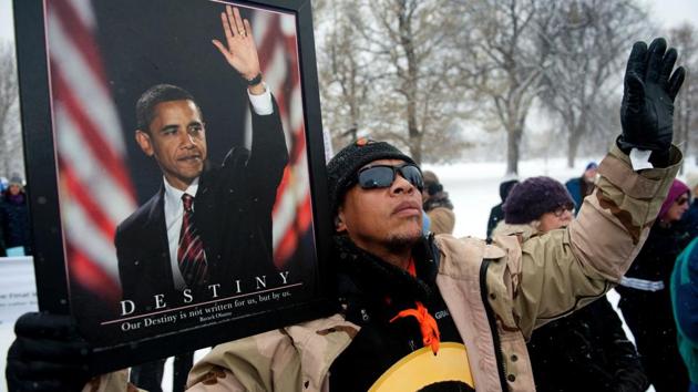 Gregory Campbell holds his hands high during prayer while gathering at City Park in Denver, Colorado at the beginning of Denver's Martin Luther King Jr. parade. (Jason Connolly/AFP) Gregory Campbell holds his hands high during prayer while gathering at City Park in Denver, Colorado at the beginning of Denver's Martin Luther King Jr. parade. (Jason Connolly/AFP)