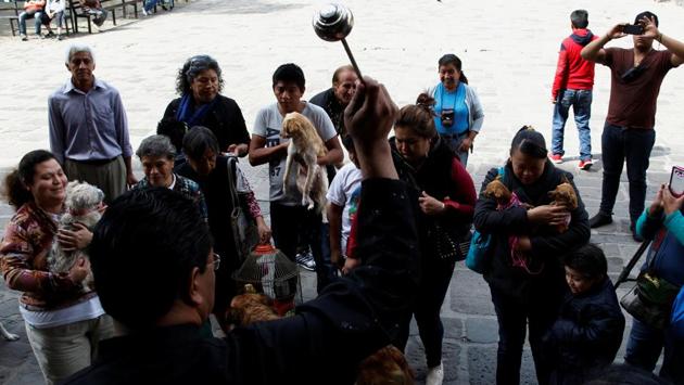 People with their pats receive blessings from a priest on the day of Saint Anthony, in Xochimilco in Mexico City, Mexico. (Carlos Jasso/REUTERS) People with their pats receive blessings from a priest on the day of Saint Anthony, in Xochimilco in Mexico City, Mexico. (Carlos Jasso/REUTERS)