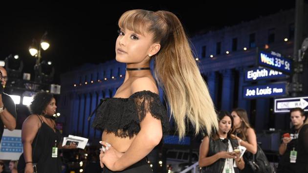 Ariana Grande’s cascading, half-up/half-down ponytail is her signature. (AP/Chris Pizzello/Invision) Ariana Grande’s cascading, half-up/half-down ponytail is her signature. (AP/Chris Pizzello/Invision)
