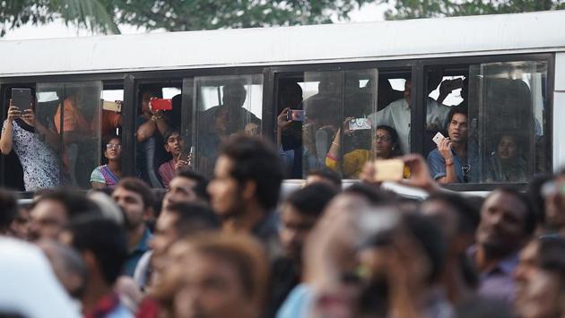 The crowd outside his house in Mumbai. The court said Mishra had granted prosecution sanction “without applying his mind”. Had he studied the case properly, “the accused would not have had to face trial”, the court said. (prodip guha/ht photo) 