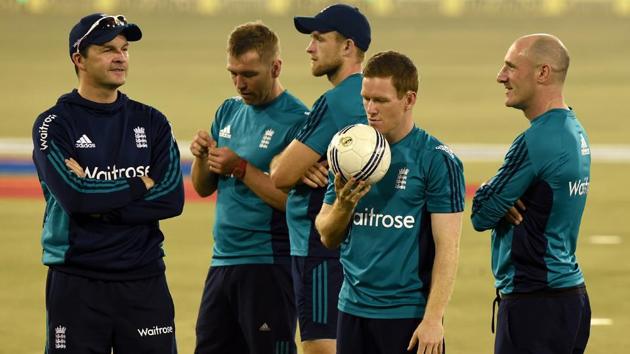 England cricket captain Eoin Morgan (2L) holds a football during a training session at the Barabati stadium in Cuttack. (AFP)
