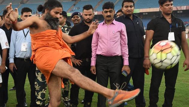 Baba Ramdev kicks the ball to inaugurate an exhibition football match between Parliamentarians' and Cinestars at Nehru stadium in New Delhi last year. (PTI) Baba Ramdev kicks the ball to inaugurate an exhibition football match between Parliamentarians' and Cinestars at Nehru stadium in New Delhi last year. (PTI)