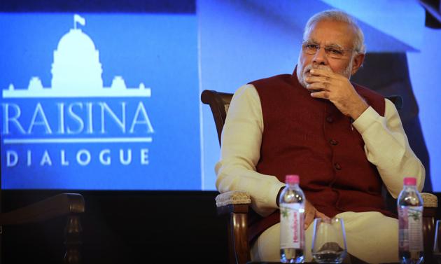 Prime Minister Narendra Modi listens to a speaker during the inauguration of the second edition of the Raisina Dialogue in New Delhi on Tuesday.(AP) Prime Minister Narendra Modi listens to a speaker during the inauguration of the second edition of the Raisina Dialogue in New Delhi on Tuesday.(AP)
