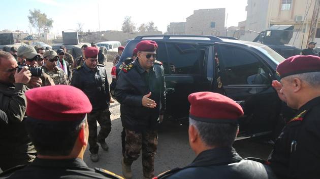 Iraqi Staff General Talib al-Sheghati (C) arrives to the town of Bartalla, east of Mosul, for a press conference on January 18, 2017. Iraqi forces have fully retaken east Mosul from the Islamic State group, a top commander said, three months after a huge offensive against the jihadist bastion was launched.(AFP)