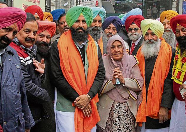 Lok Insaaf Party candidates Simarjeet Singh Bains and Balwinder Singh Bains came to file their nominations with their mother on Wednesday. (JS Grewal /HT) Lok Insaaf Party candidates Simarjeet Singh Bains and Balwinder Singh Bains came to file their nominations with their mother on Wednesday. (JS Grewal /HT)