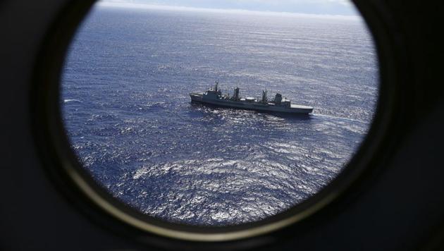 HMAS Success scans the southern Indian Ocean, near the coast of Western Australia, as a Royal New Zealand Air Force P3 Orion flies over, while searching for missing Malaysia Airlines Flight MH370. (AP File PHoto) HMAS Success scans the southern Indian Ocean, near the coast of Western Australia, as a Royal New Zealand Air Force P3 Orion flies over, while searching for missing Malaysia Airlines Flight MH370. (AP File PHoto)