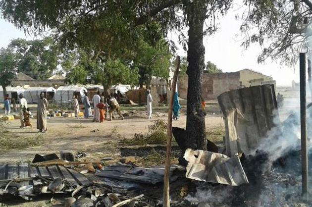 This handout image received courtesy of Doctors Without Border (MSF) on January 17, 2017, shows people standing next to destruction after an air force jet accidentally bombarded a camp for those displaced by Boko Haram Islamists, in Rann, northeast Nigeria. (AFP Photo) This handout image received courtesy of Doctors Without Border (MSF) on January 17, 2017, shows people standing next to destruction after an air force jet accidentally bombarded a camp for those displaced by Boko Haram Islamists, in Rann, northeast Nigeria. (AFP Photo)