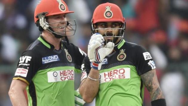 AB de Villiers (left) is not in a hurry to return to playing Test cricket after an elbow surgery, but reuniting with Virat Kohli (right) in IPL 2017 is a priority for the South African cricketing icon. (Hindustan Times) AB de Villiers (left) is not in a hurry to return to playing Test cricket after an elbow surgery, but reuniting with Virat Kohli (right) in IPL 2017 is a priority for the South African cricketing icon. (Hindustan Times)