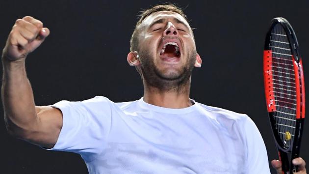 Britain's Dan Evans celebrates his victory against Croatia's Marin Cilic during their men's singles match on day three of the Australian Open tennis tournament.(AFP)