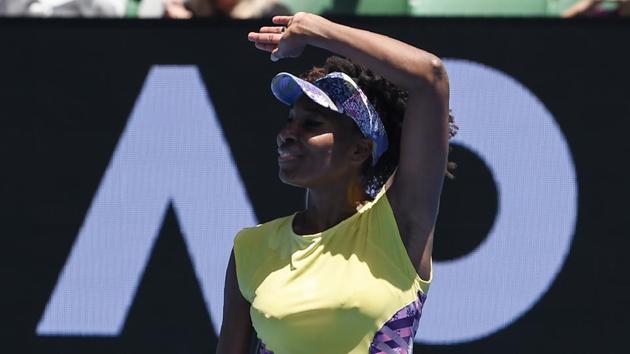 The 36-year-old battled an elbow injury but managed to progress to the third round. (AFP)