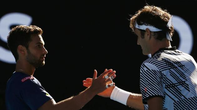 Federer fought back from a break down in the final set to win 7-5, 6-3, 7-6 (7/3) to enter the third round. (REUTERS)