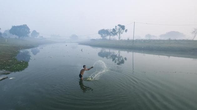 A man takes a dip on a cold morning. (Ravi Choudhary/HT PHOTO) A man takes a dip on a cold morning. (Ravi Choudhary/HT PHOTO)