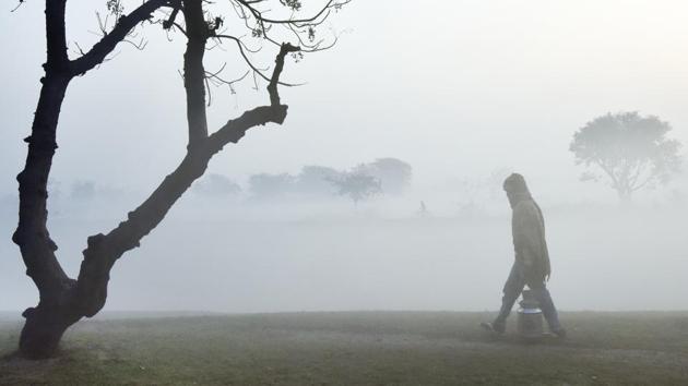 A milkman walks through fields during on a cold foggy morning in New Delhi. (Ravi Choudhary/HT PHOTO) A milkman walks through fields during on a cold foggy morning in New Delhi. (Ravi Choudhary/HT PHOTO)