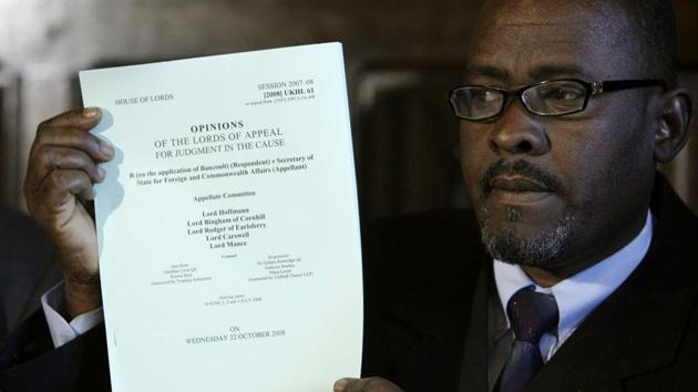 Chagos Islander Olivier Bancoult holds up a judgment paper inside the Houses of Parliament in London October 22, 2008, after a court ruling decided the islanders were not allowed to return to their homeland. Britain evicted about 2,000 people from the tropical Chagos archipelago, a British colony, in the 1960s and 1970s so the US military could build an air base on Diego Garcia, the largest of the islands.(AP FILE)