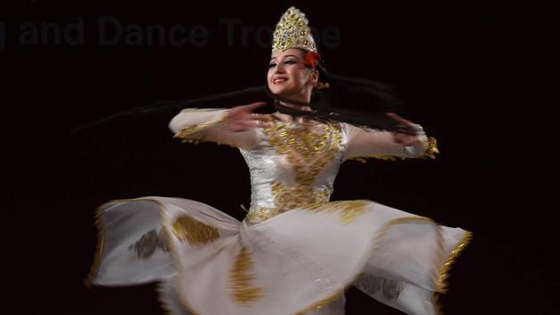 A member of Xinjiang Art Theatre song and Dance troupe performs double dance called Melody of Love. Highly regarded by audiences in the world, Xinjiang Art Theater Song and Dance Troupe toured more than 90 countries and regions in the world. (Arvind Yadav/HT PHOTO) A member of Xinjiang Art Theatre song and Dance troupe performs double dance called Melody of Love. Highly regarded by audiences in the world, Xinjiang Art Theater Song and Dance Troupe toured more than 90 countries and regions in the world. (Arvind Yadav/HT PHOTO)