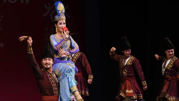 Members of Xinjiang Art Theatre song and Dance troupe performs in Group dance Flower pattern Waistband. ICEC has been organizing the Chinese Spring Festival unfailingly for the past many years, generating a great enthusiasm about Chinese culture in India. (Arvind Yadav/HT PHOTO) Members of Xinjiang Art Theatre song and Dance troupe performs in Group dance Flower pattern Waistband. ICEC has been organizing the Chinese Spring Festival unfailingly for the past many years, generating a great enthusiasm about Chinese culture in India. (Arvind Yadav/HT PHOTO)
