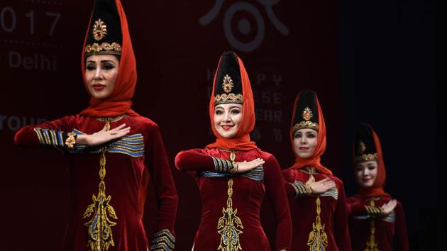 Members of Xinjiang Art Theatre song and Dance troupe perform in Chinese Cultural show group dance Jula. Regular visit of delegations, launching of China related books, organizing classes on Chinese language and culture are the activities successfully carried forward by ICEC to mention a few. (Arvind Yadav/HT PHOTO) Members of Xinjiang Art Theatre song and Dance troupe perform in Chinese Cultural show group dance Jula. Regular visit of delegations, launching of China related books, organizing classes on Chinese language and culture are the activities successfully carried forward by ICEC to mention a few. (Arvind Yadav/HT PHOTO)