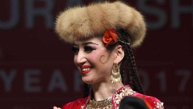 A member of Xinjiang Art Theatre song and Dance troupe celebrates the success of the show. (Arvind Yadav/HT PHOTO) A member of Xinjiang Art Theatre song and Dance troupe celebrates the success of the show. (Arvind Yadav/HT PHOTO)