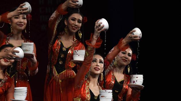Artists from Xinjiang Art Theatre song and Dance troupe perform ‘Bowl Dance’ during a cultural event celebrating Chinese New Year. The event was organized to celebrate “Chinese New Year 2017” by Embassy of the People’s Republic of China in the Republic of India, in association with China National Tourist Office and India China Economic and Cultural Council. (Arvind Yadav/HT PHOTo) Artists from Xinjiang Art Theatre song and Dance troupe perform ‘Bowl Dance’ during a cultural event celebrating Chinese New Year. The event was organized to celebrate “Chinese New Year 2017” by Embassy of the People’s Republic of China in the Republic of India, in association with China National Tourist Office and India China Economic and Cultural Council. (Arvind Yadav/HT PHOTo)