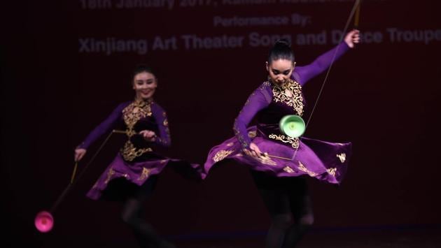 Artists from Xinjiang Art Theatre song and Dance troupe perform acrobatics Play Diablo during the event. Every year, a cultural evening is organized to celebrate the occasion of Chinese New Year in India. (Arvind Yadav/HT PHOTO) Artists from Xinjiang Art Theatre song and Dance troupe perform acrobatics Play Diablo during the event. Every year, a cultural evening is organized to celebrate the occasion of Chinese New Year in India. (Arvind Yadav/HT PHOTO)