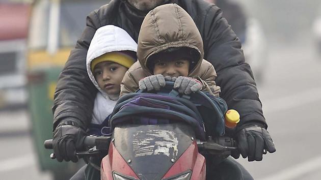 Students going to school bundled up in warm clothes in New Delhi. (Raj K Raj/HT File) Students going to school bundled up in warm clothes in New Delhi. (Raj K Raj/HT File)