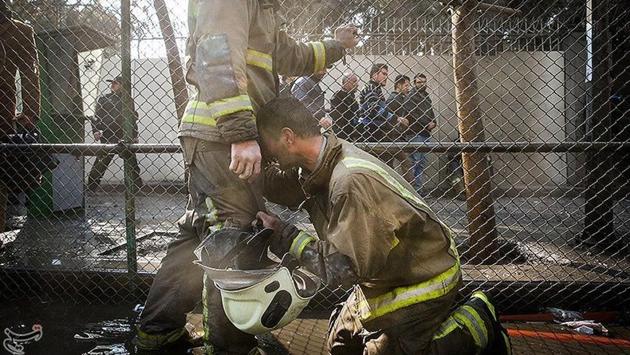 A firefighter reacts at the site of the blazing high-rise building in Tehran, Iran. The Plasco building contained some 400 business units as well as workshops. (REUTERS) A firefighter reacts at the site of the blazing high-rise building in Tehran, Iran. The Plasco building contained some 400 business units as well as workshops. (REUTERS)
