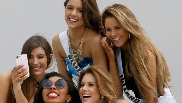 Miss Universe contestants take a selfie aboard the yacht Happy Life prior to cruising to a beach resort in Batangas province in Philippines. (AP) Miss Universe contestants take a selfie aboard the yacht Happy Life prior to cruising to a beach resort in Batangas province in Philippines. (AP)