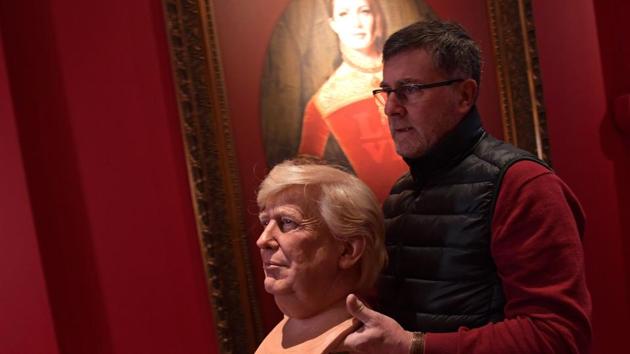 A sculptor carries the head of the waxwork model of US President-elect Donald Trump ahead of its unveiling at the Grevin museum in Paris on January 19, 2017. (AFP) A sculptor carries the head of the waxwork model of US President-elect Donald Trump ahead of its unveiling at the Grevin museum in Paris on January 19, 2017. (AFP)