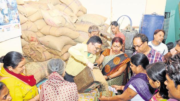 Under the food law, over 80 crore people get 5 kg wheat or rice per person per month at Rs 2-3 per kg costing exchequer Rs 1.4 lakh crore annually. (HT file) Under the food law, over 80 crore people get 5 kg wheat or rice per person per month at Rs 2-3 per kg costing exchequer Rs 1.4 lakh crore annually. (HT file)