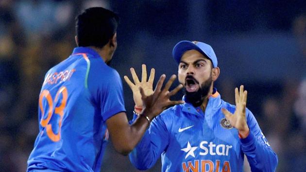 Jasprit Bumrah (L) celebrates with skipper Virat Kohli after dismissing England batsman Alex Hales. (PTI) Jasprit Bumrah (L) celebrates with skipper Virat Kohli after dismissing England batsman Alex Hales. (PTI)