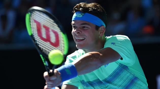 Canada's Milos Raonic hits a return against Luxembourg's Gilles Muller. (AFP) 