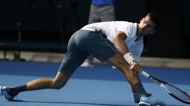 Serbia's Novak Djokovic struggles to return during the second round match against Uzbekistan's Denis Istomin at the Australian Open on Thursday. (REUTERS) Serbia's Novak Djokovic struggles to return during the second round match against Uzbekistan's Denis Istomin at the Australian Open on Thursday. (REUTERS)