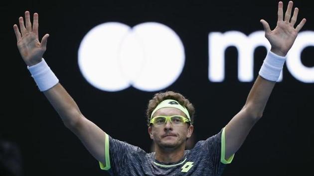Denis Istomin celebrates after winning his match against Serbia's Novak Djokovic. (reuters) 