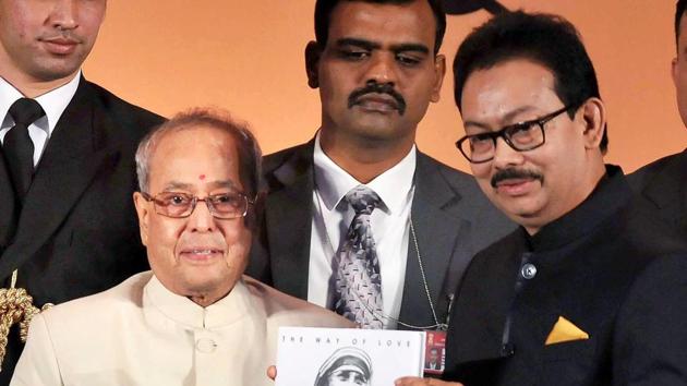 President Pranab Mukherjee receives a book on Saint Mother Teresa from Satyam Roychowdhury (R), chairman of Aajkaal Newspaper, during the inauguration ceremony of the 35th anniversary celebrations of the Bangla daily in Kolkata on Thursday evening. (PTI) President Pranab Mukherjee receives a book on Saint Mother Teresa from Satyam Roychowdhury (R), chairman of Aajkaal Newspaper, during the inauguration ceremony of the 35th anniversary celebrations of the Bangla daily in Kolkata on Thursday evening. (PTI)