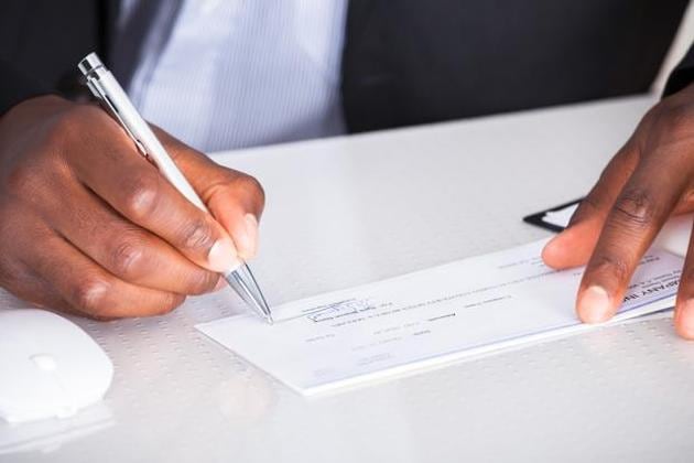 The police said that the two NRIs had sent cheques via courier to their payees in India but the cheques were misplaced, manipulated and deposited in an alleged fraud’s account. (HT file photo for representation) The police said that the two NRIs had sent cheques via courier to their payees in India but the cheques were misplaced, manipulated and deposited in an alleged fraud’s account. (HT file photo for representation)