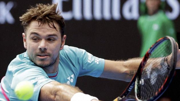 Stan Wawrinka makes a backhand return to Serbia's Viktor Troicki during their third round match at the Australian Open. (AP)