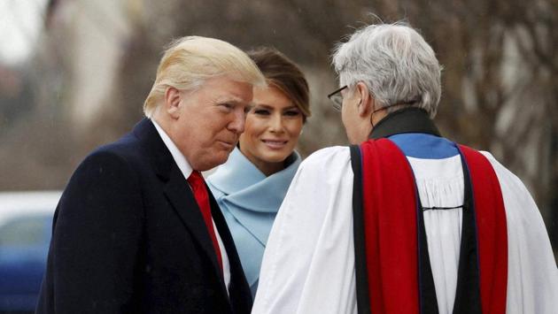 Rev Luis Leon greets President-elect Donald Trump and his wife Melania as they arrive for a church service at St. John‚ Äôs Episcopal Church across from the White House in Washington, on Friday, the inauguration day. (AP) Rev Luis Leon greets President-elect Donald Trump and his wife Melania as they arrive for a church service at St. John‚ Äôs Episcopal Church across from the White House in Washington, on Friday, the inauguration day. (AP)