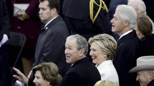 Former President George W Bush, left, his wife Laura, former secretary of state Hillary Clinton and former President Bill Clinton wait for the 58th Presidential Inauguration of Donald Trump. (AP) Former President George W Bush, left, his wife Laura, former secretary of state Hillary Clinton and former President Bill Clinton wait for the 58th Presidential Inauguration of Donald Trump. (AP)