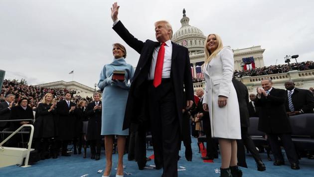 US President Donald Trump acknowledges the audience after taking the oath of office as his wife Melania (L) and daughter Tiffany watch after his during inauguration ceremony on the West front of the US Capitol in Washington, DC. (REUTERS) US President Donald Trump acknowledges the audience after taking the oath of office as his wife Melania (L) and daughter Tiffany watch after his during inauguration ceremony on the West front of the US Capitol in Washington, DC. (REUTERS)