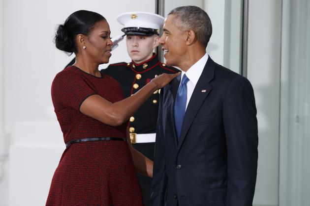 First lady Michelle Obama shares a moment with her husband and outgoing US president Barack Obama as they wait for President-elect Donald Trump and his wife Melania Trump at the White House on Friday, in Washington. (AP) First lady Michelle Obama shares a moment with her husband and outgoing US president Barack Obama as they wait for President-elect Donald Trump and his wife Melania Trump at the White House on Friday, in Washington. (AP)