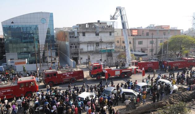 A fire broke out in a garment manufacturing company at Sector 4 Noida on Thursday afternoon. Employees trapped in the building were rescued by locals and firefighters. (Burhaan Kinu/HT Photo) A fire broke out in a garment manufacturing company at Sector 4 Noida on Thursday afternoon. Employees trapped in the building were rescued by locals and firefighters. (Burhaan Kinu/HT Photo)