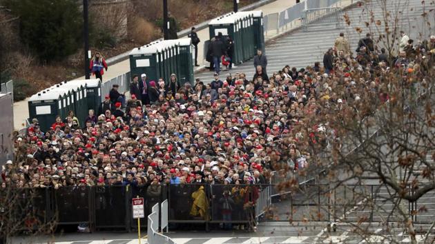 People line up behind security fencing on Capitol grounds ahead of Donald Trump being sworn in as the 45th president of the United States in Washington, US, on Friday. (REUTERS) People line up behind security fencing on Capitol grounds ahead of Donald Trump being sworn in as the 45th president of the United States in Washington, US, on Friday. (REUTERS)