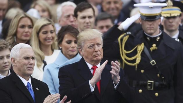 President Donald Trump and vice president Mike Pence applaud following their inauguration ceremony on the West front of the US Capitol in Washington. (REUTERS) President Donald Trump and vice president Mike Pence applaud following their inauguration ceremony on the West front of the US Capitol in Washington. (REUTERS)