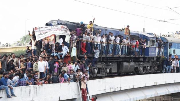Madurai: Youngsters stage a rail roko protest condemning the ban on Jallikattu at Tamukkam in Madurai on Thursday.(PTI Photo)