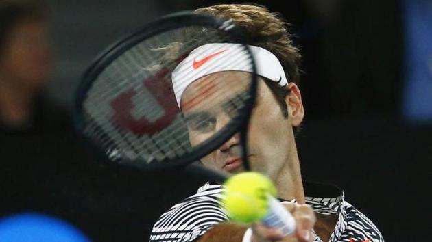 Switzerland's Roger Federer hits a shot for his Men's singles third round match against Czech Republic's Tomas Berdych. (REUTERS)